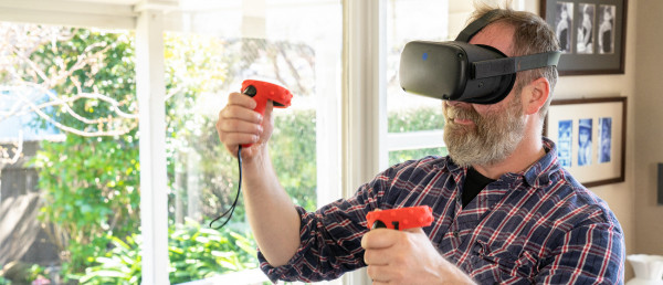 Man using a VR headset at home