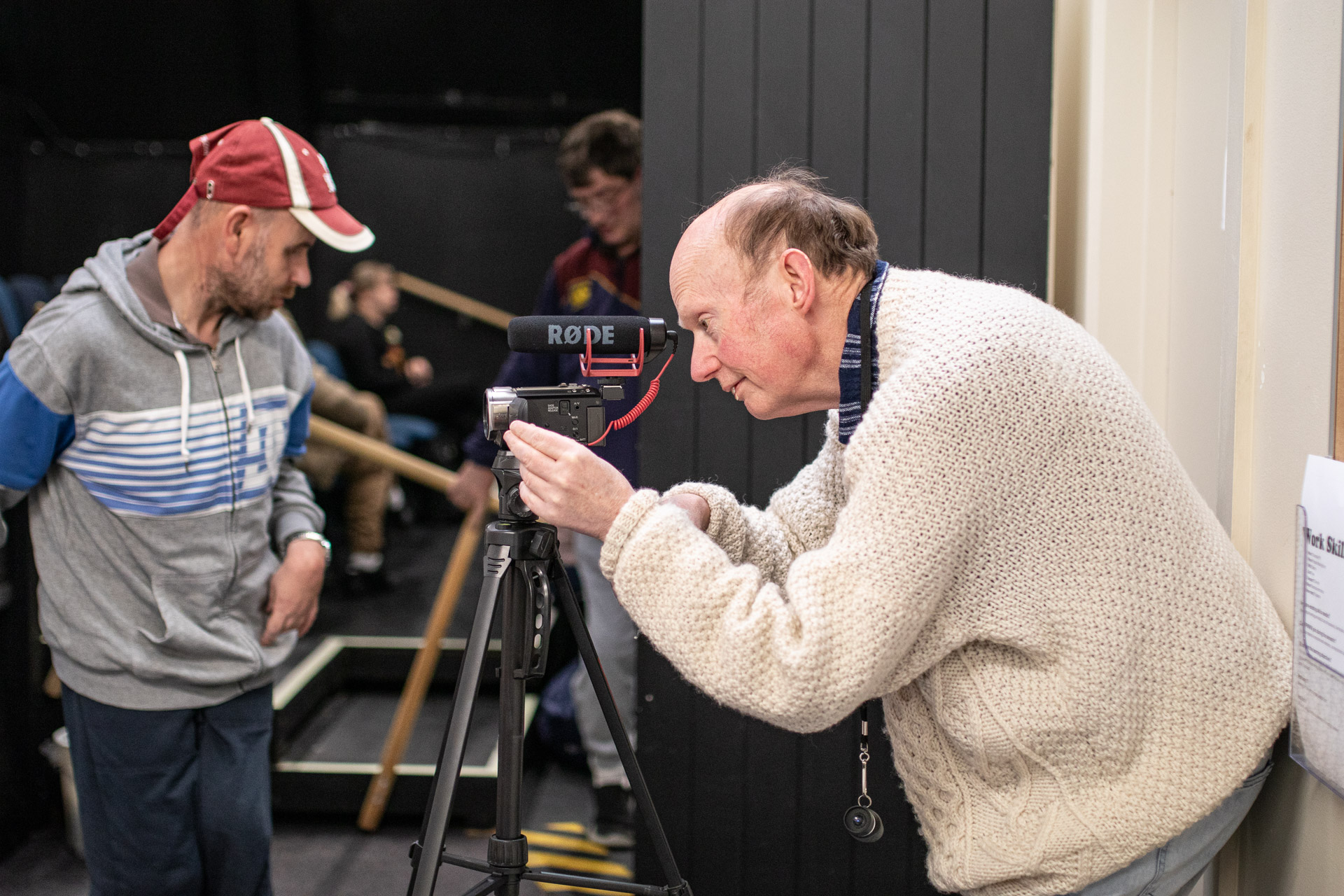 Person filming with video camera