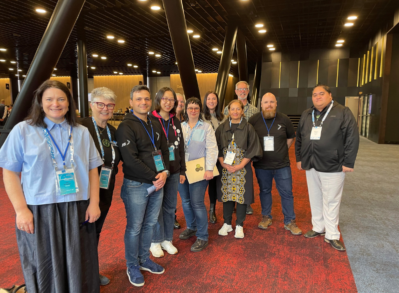 Internet NZ staff stand in a line at APNIC 58